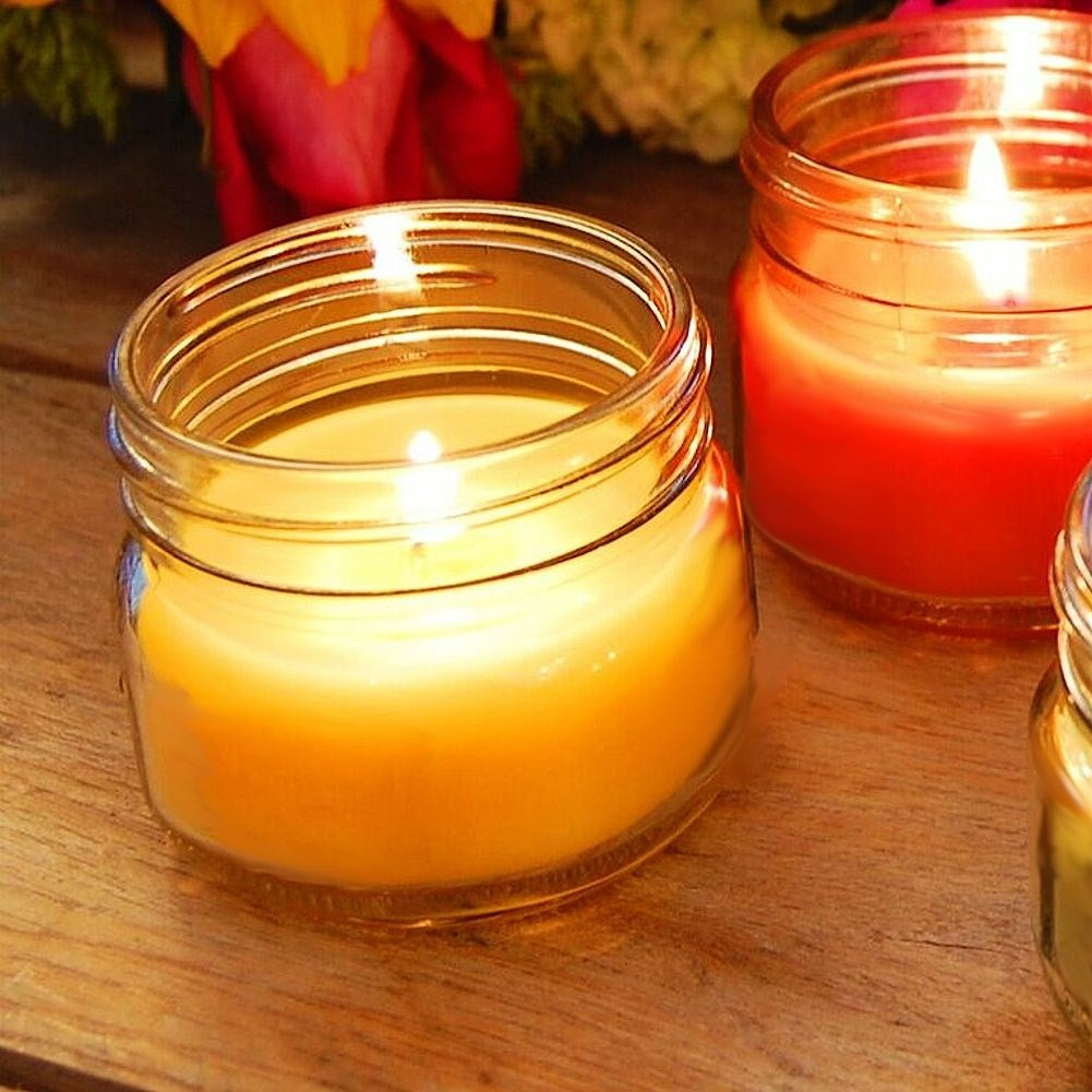 Scented candle with essential lemon oil for a cozy atmosphere
