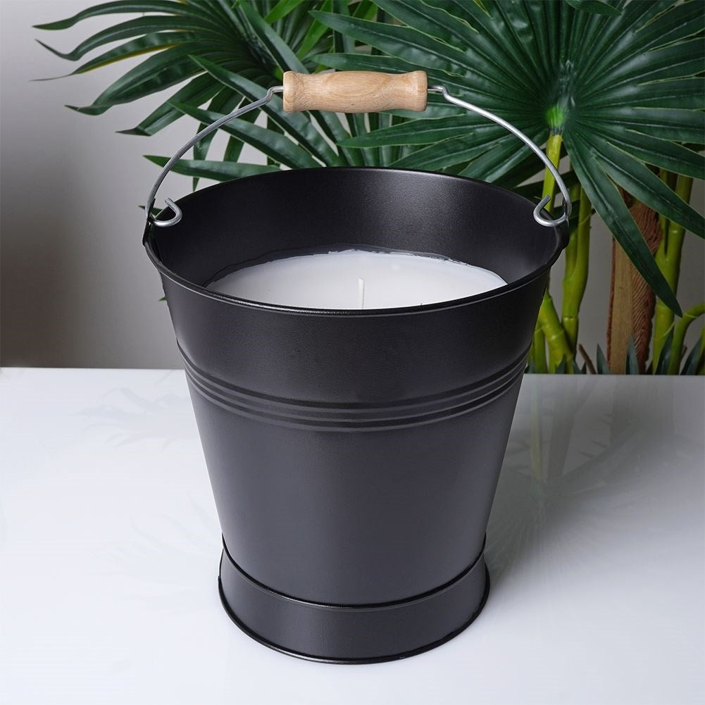 Scented candle with fresh lemon oil for a cozy atmosphere