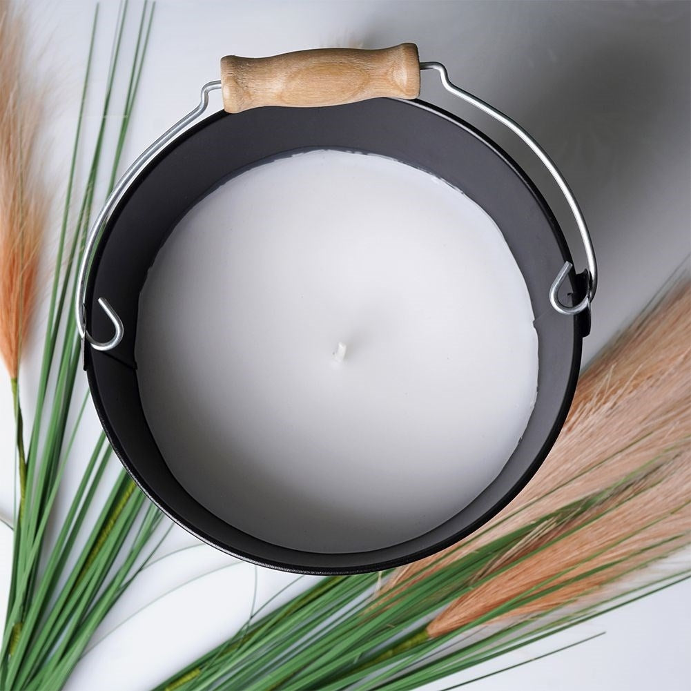 Scented candle with fresh lemon oil for a cozy atmosphere