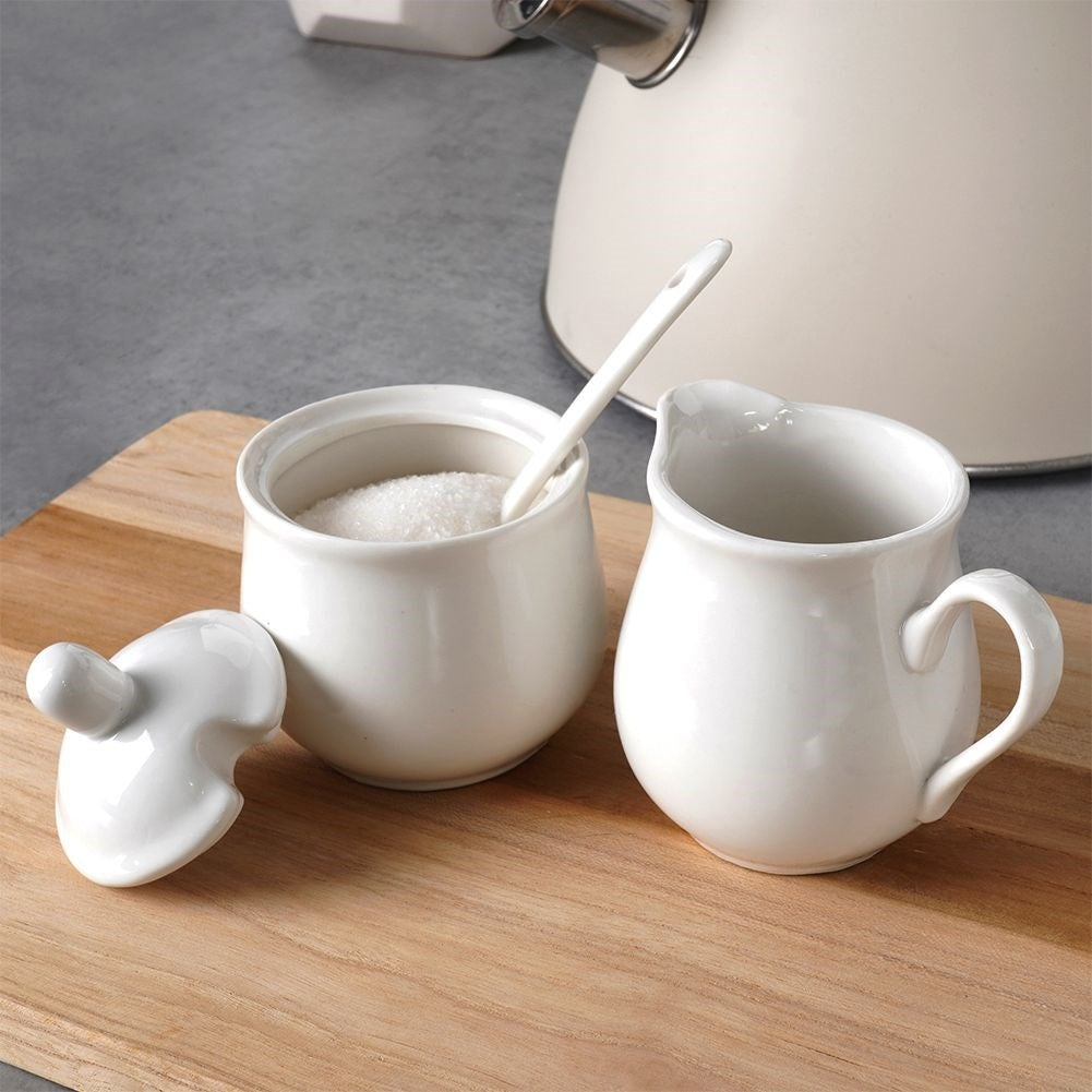 Set for serving sugar and milk in white porcelain