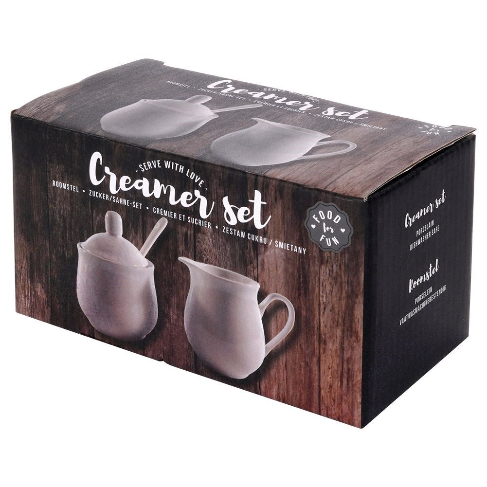 Set for serving sugar and milk in white porcelain