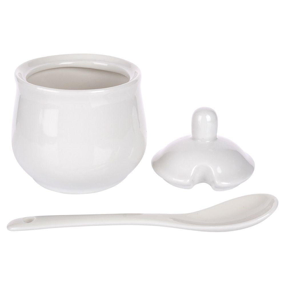 Set for serving sugar and milk in white porcelain