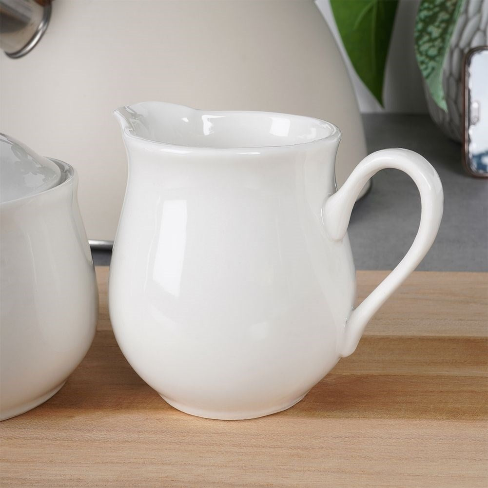 Set for serving sugar and milk in white porcelain