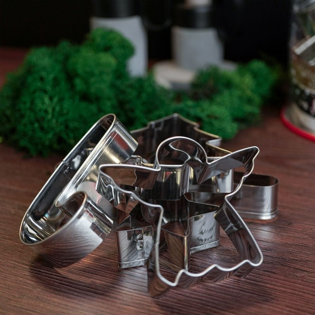 Set of 16 stainless steel Christmas cookie tins with storage