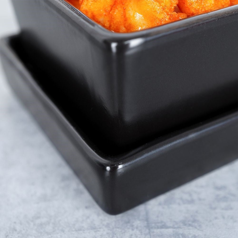 Set of 3 black ceramic bowls on tray for serving