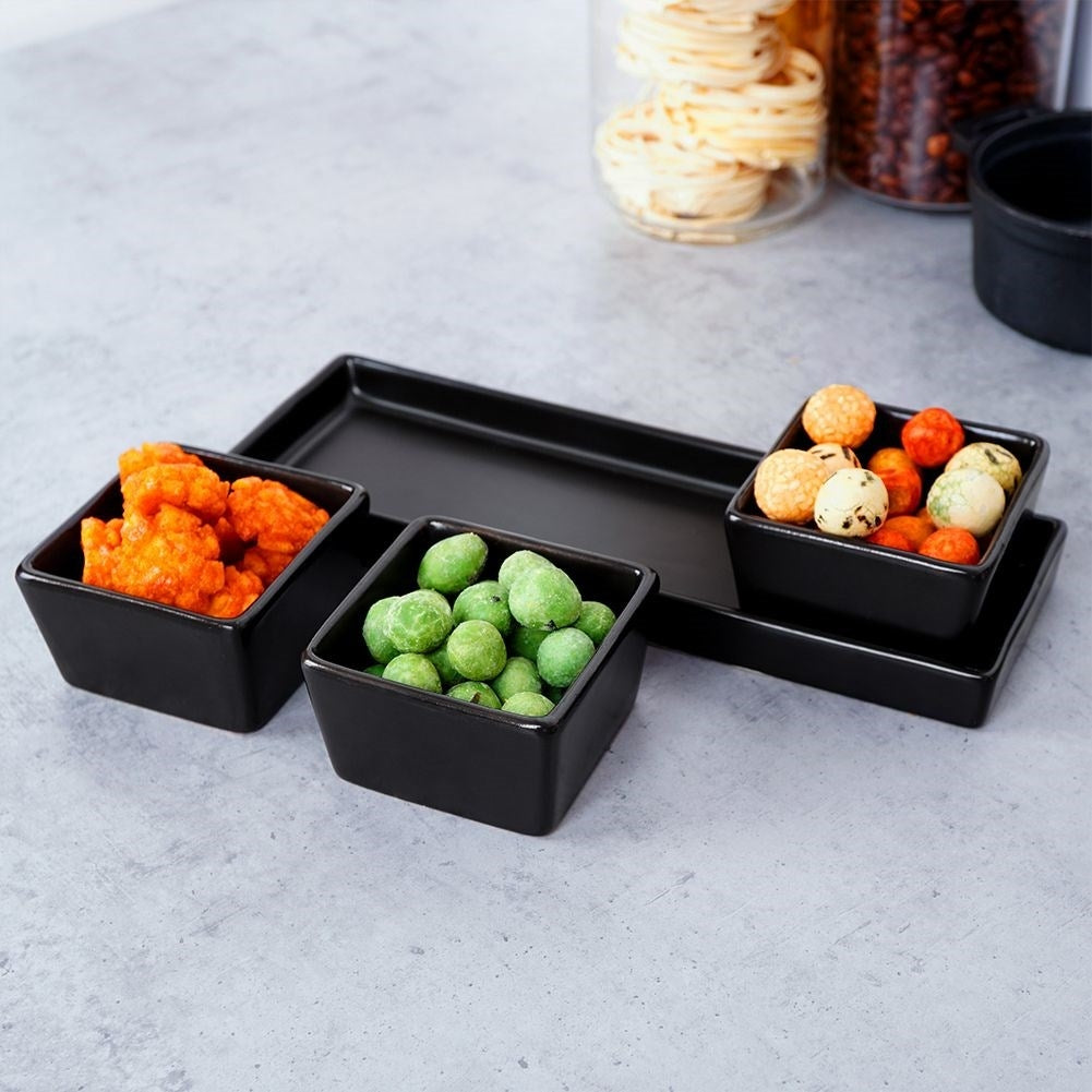 Set of 3 black ceramic bowls on tray for serving