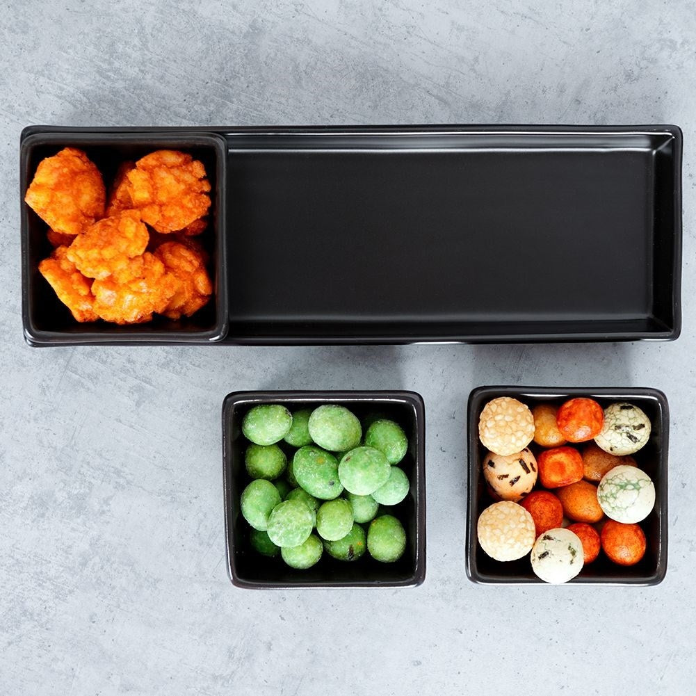 Set of 3 black ceramic bowls on tray for serving