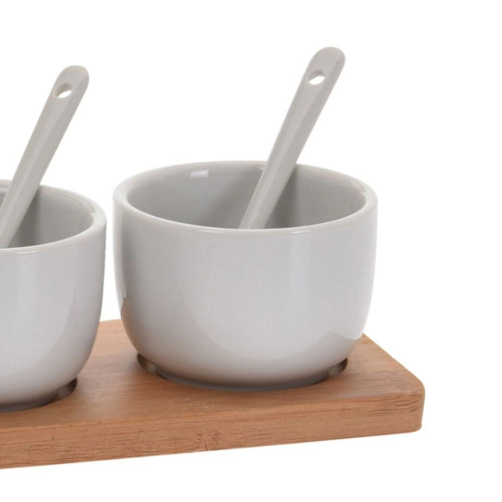 Set of 3 ceramic bowls on bamboo tray with spoons for serving