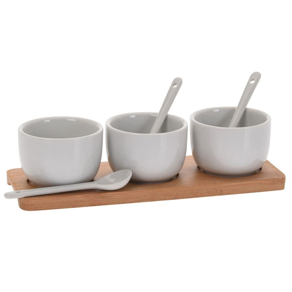 Set of 3 ceramic bowls on bamboo tray with spoons for serving