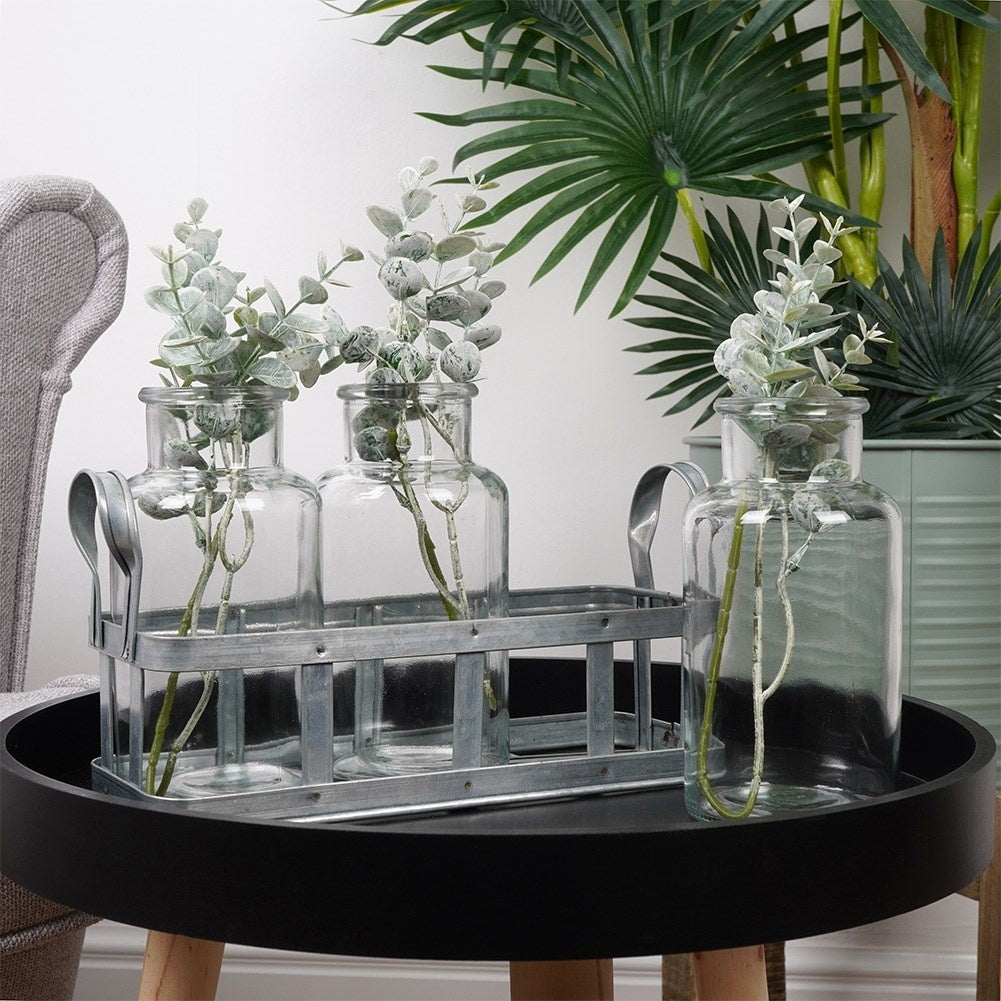 Set of 3 elegant glass vases on a stylish metal stand