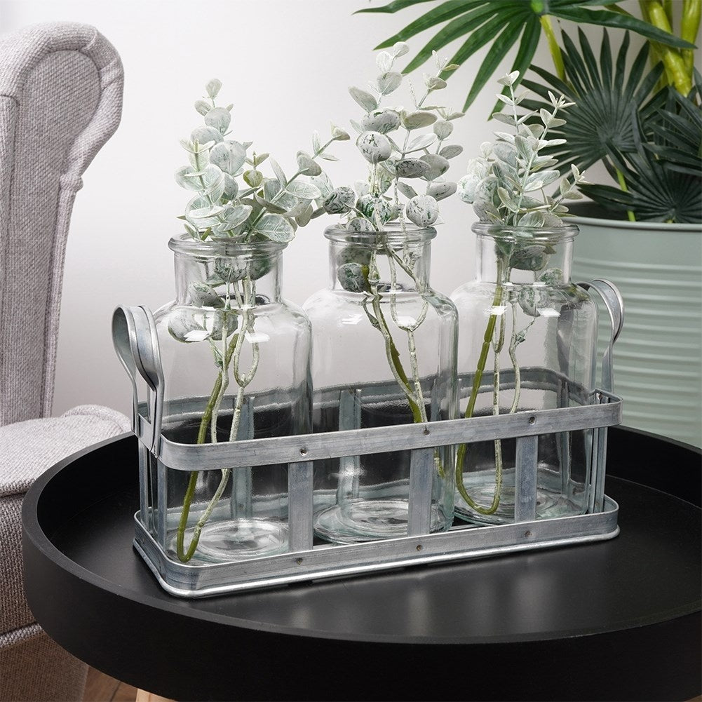 Set of 3 elegant glass vases on a stylish metal stand