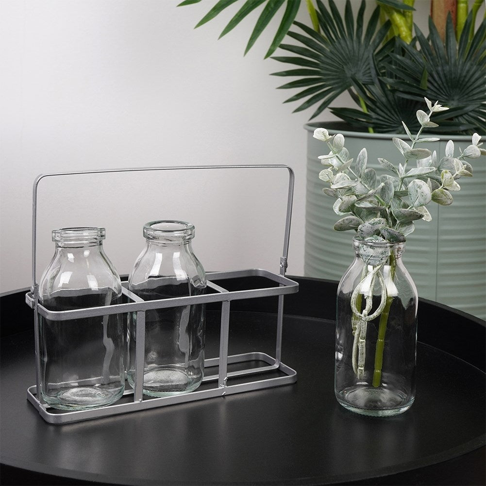 Set of 3 elegant glass vases on a stylish metal stand