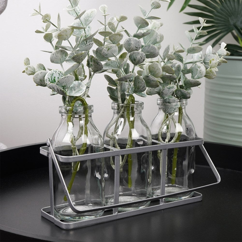 Set of 3 elegant glass vases on a stylish metal stand