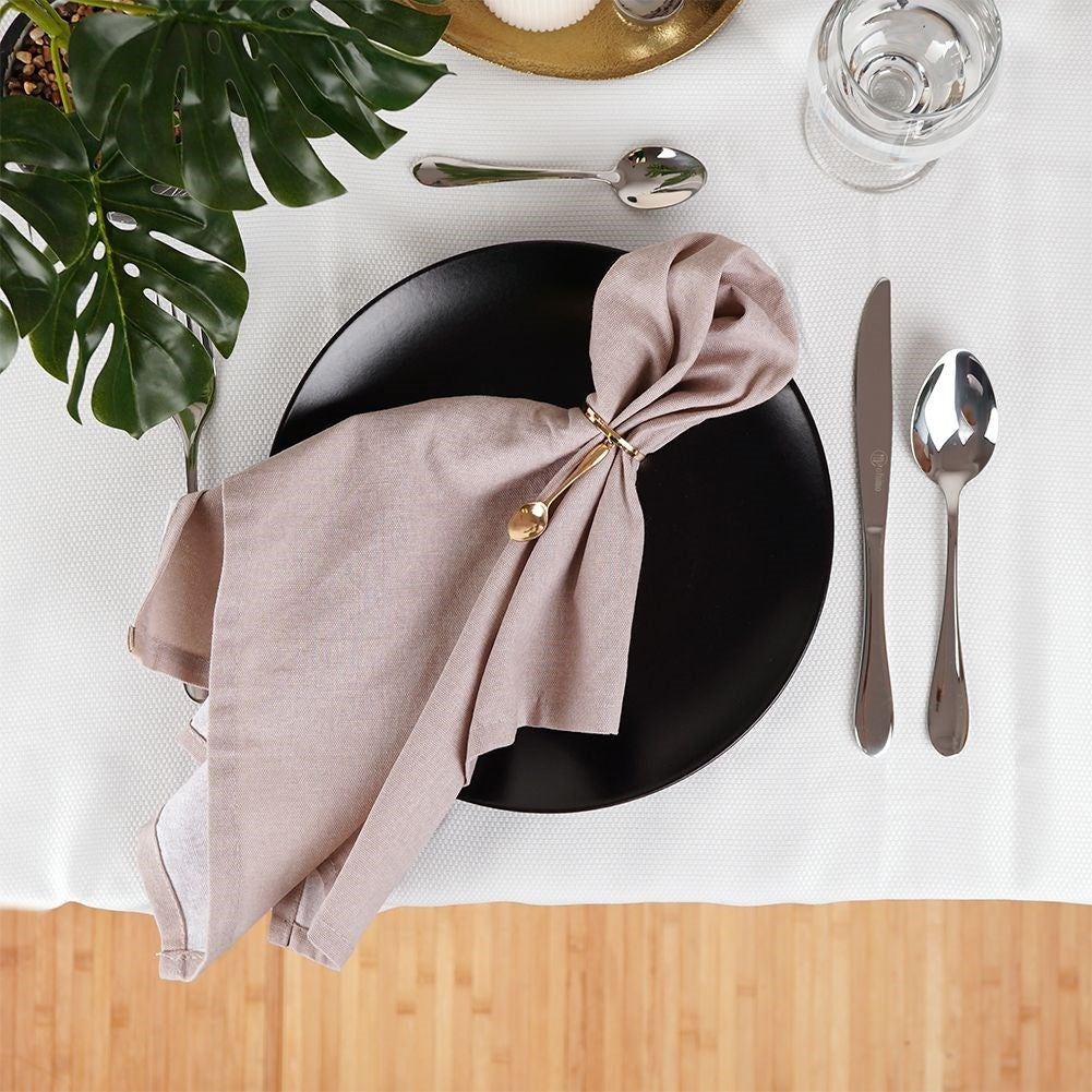 Set of 4 elegant napkin rings in gold, luxurious table setting
