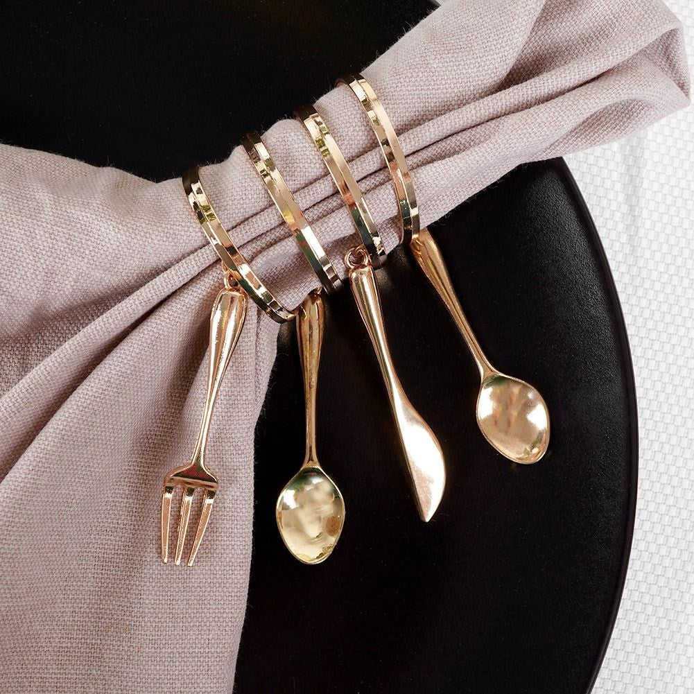 Set of 4 elegant napkin rings in gold, luxurious table setting