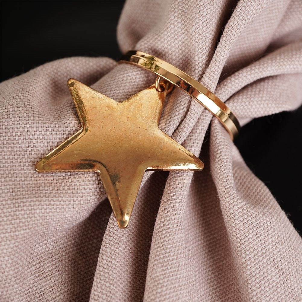 Set of 4 gold napkin rings with stars, 4 cm diameter