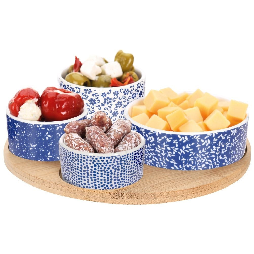 Set of 4 porcelain bowls on bamboo tray for serving