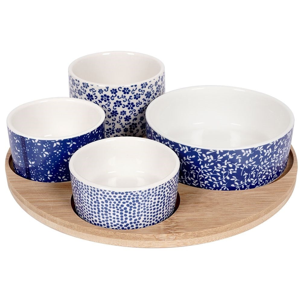 Set of 4 porcelain bowls on bamboo tray for serving