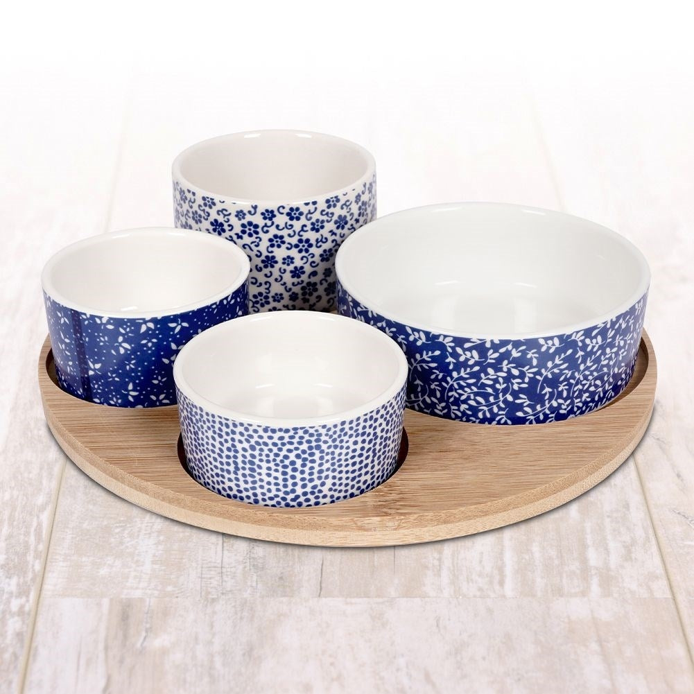 Set of 4 porcelain bowls on bamboo tray for serving