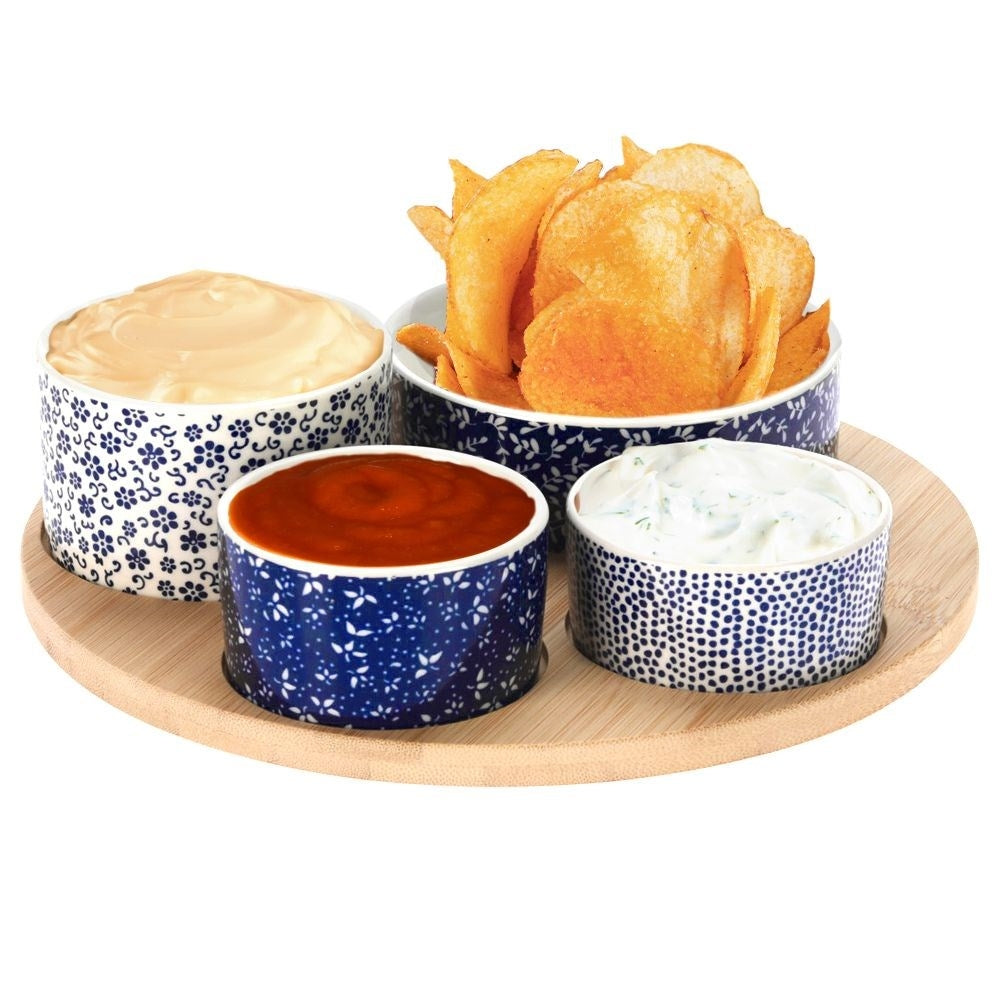 Set of 4 porcelain bowls on bamboo tray for serving