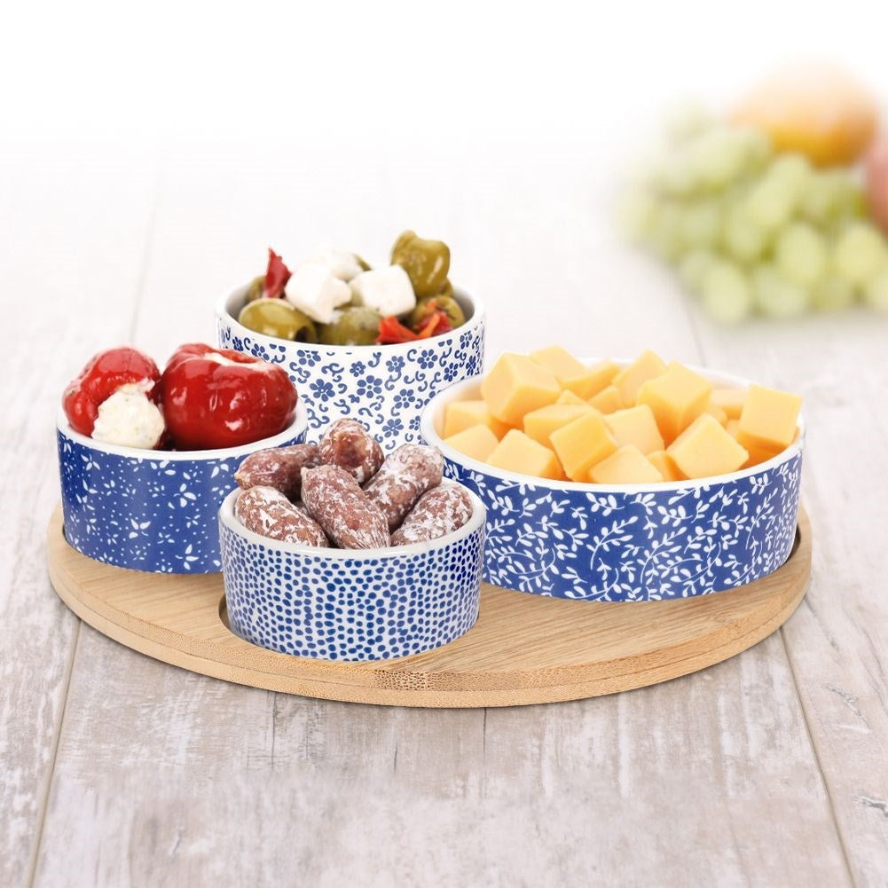 Set of 4 porcelain bowls on bamboo tray for serving