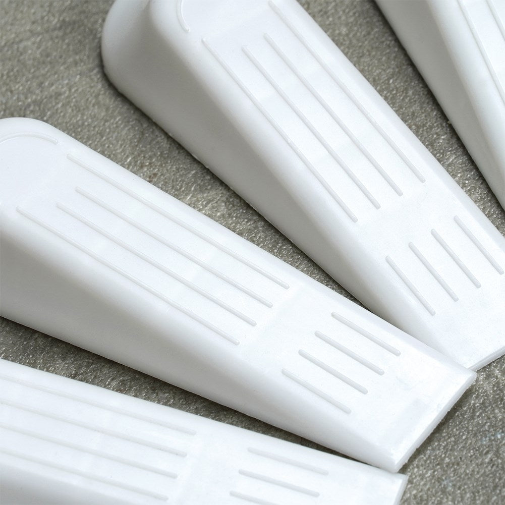 Set of 5 white plastic door stops, protects doors and floors