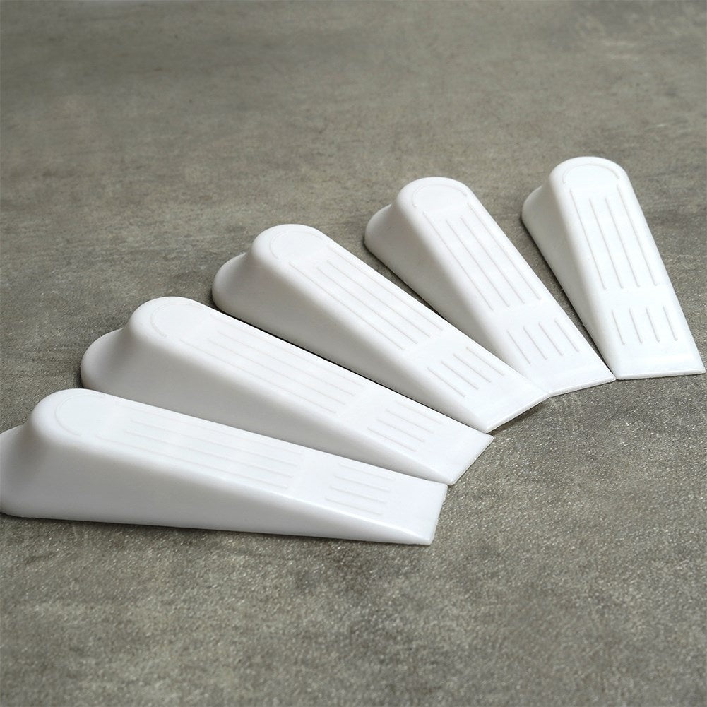 Set of 5 white plastic door stops, protects doors and floors