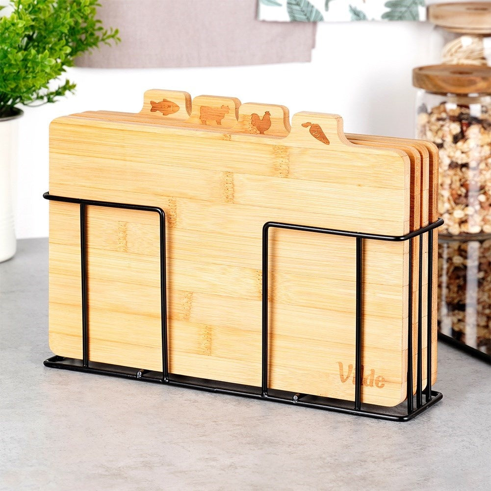 Set of bamboo cutting boards in a metal stand with a unique design
