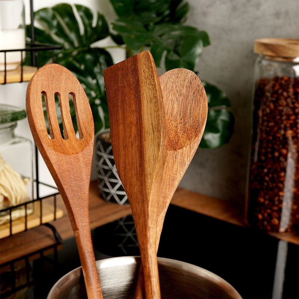 Set of kitchen utensils in acacia wood: all-round spoon, slotted spoon, universal spoon