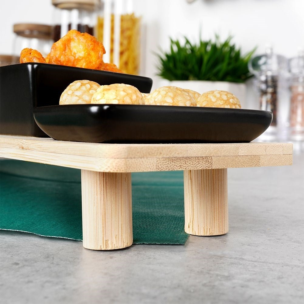 Set of six bowls on a bamboo tray for snacks and dips