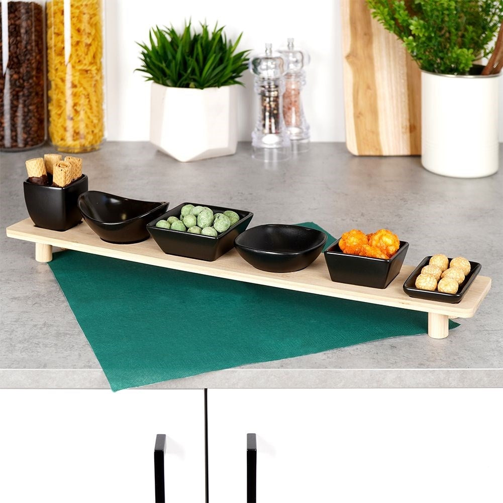 Set of six bowls on a bamboo tray for snacks and dips
