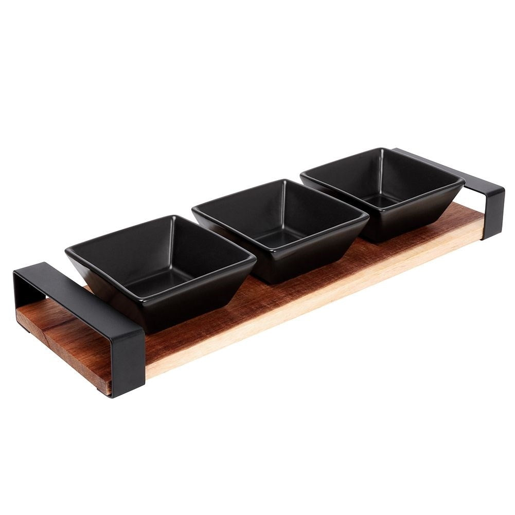 Set of three bowls on acacia tray for snacks and sauces