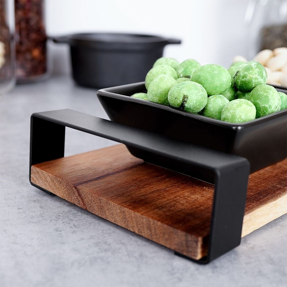 Set of three bowls on acacia tray for snacks and sauces