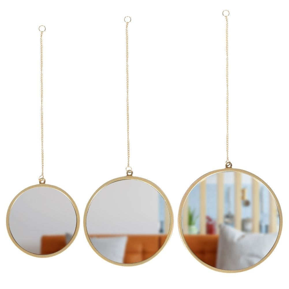 Set of three elegant wall mirrors with golden frames