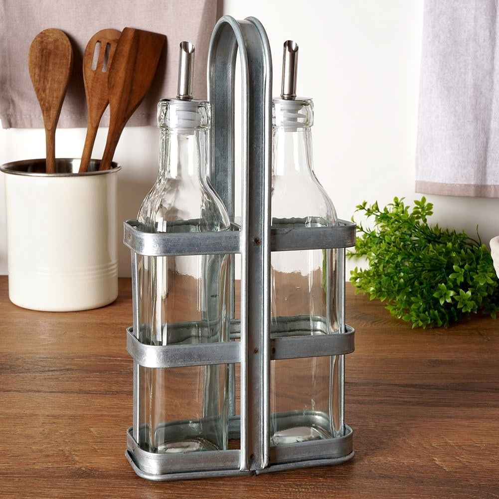 Set of two glass bottles with dispenser and stand in stainless steel