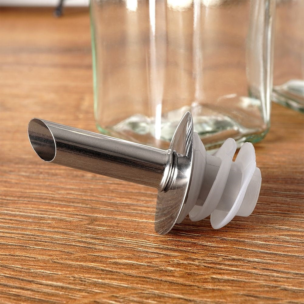 Set of two glass bottles with dispenser and stand in stainless steel