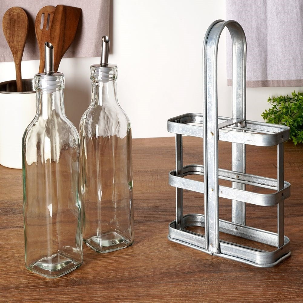 Set of two glass bottles with dispenser and stand in stainless steel