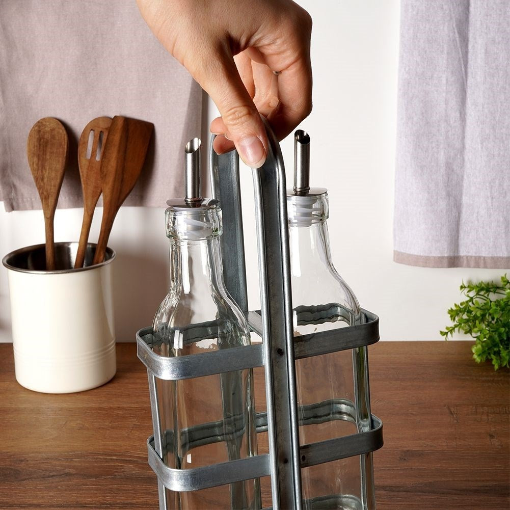 Set of two glass bottles with dispenser and stand in stainless steel