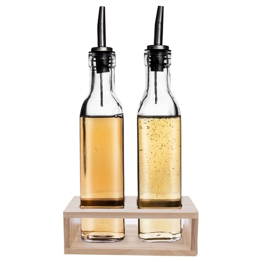 Set of two glass bottles with dispenser in wooden stand