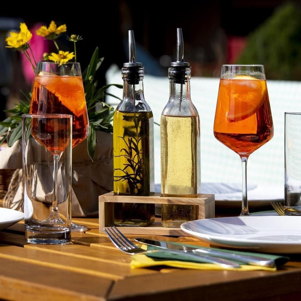 Set of two glass bottles with dispenser in wooden stand