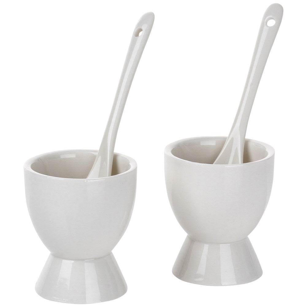 Set of two white porcelain egg cups with spoons
