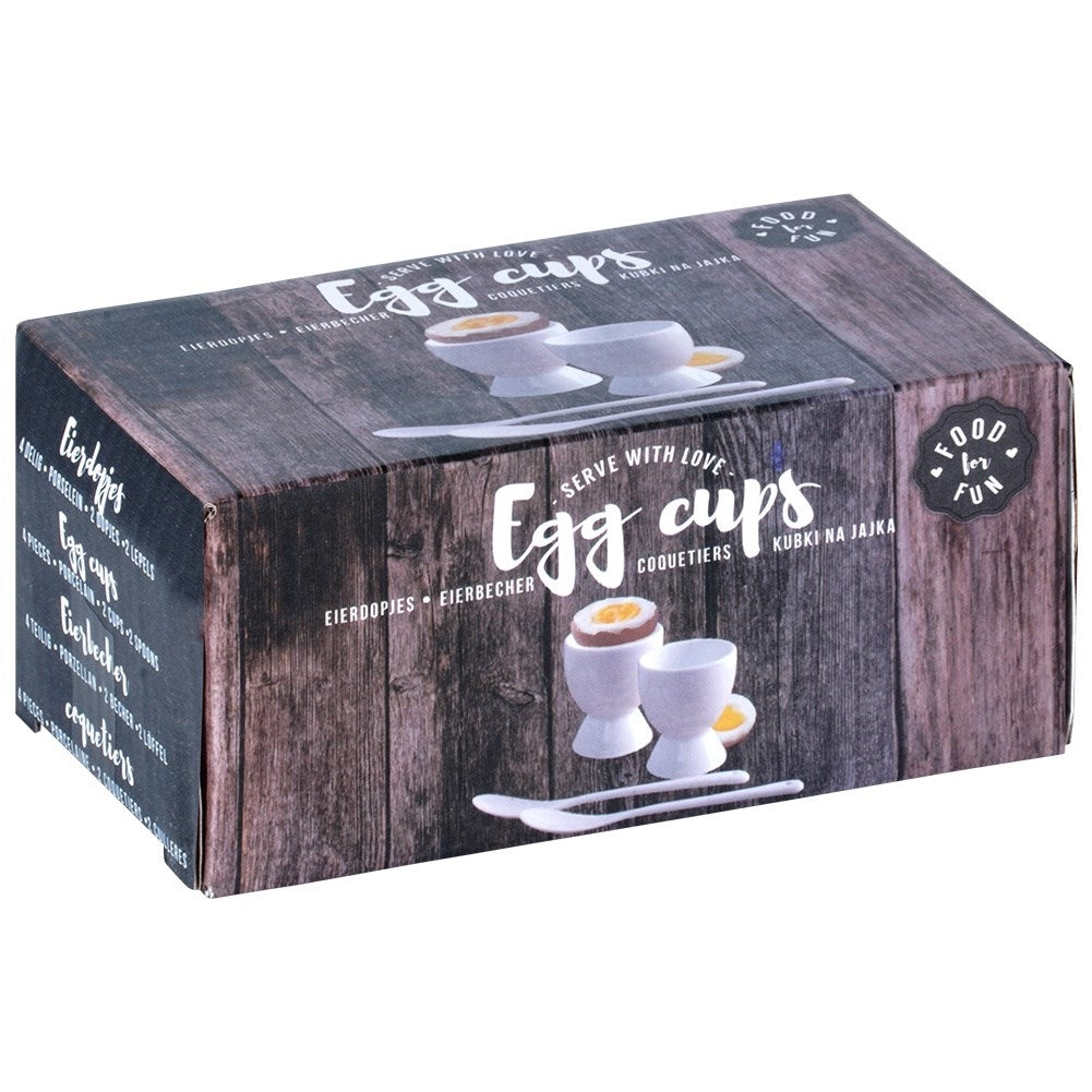 Set of two white porcelain egg cups with spoons