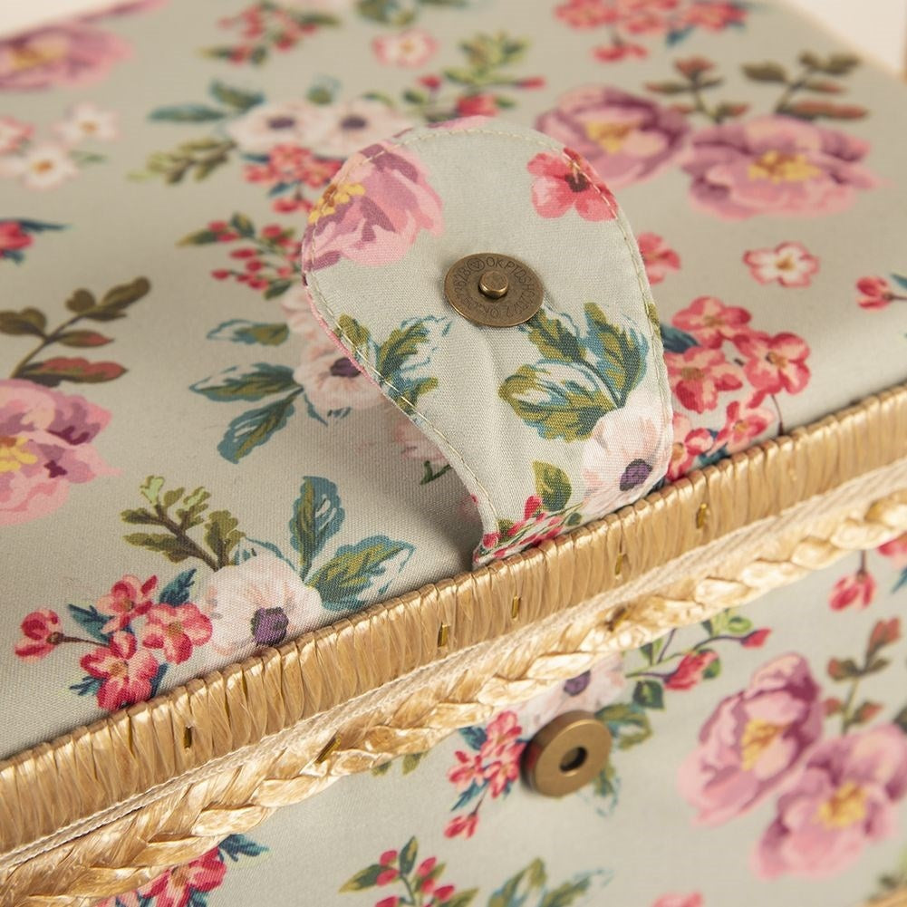 Sewing basket with compartment, floral pattern, storage of sewing accessories.