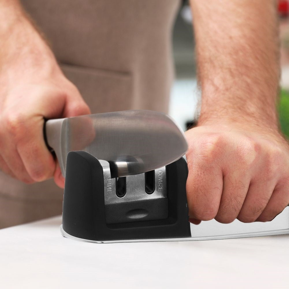 Sharpening tool for steel and ceramic knives with two sharpening blades