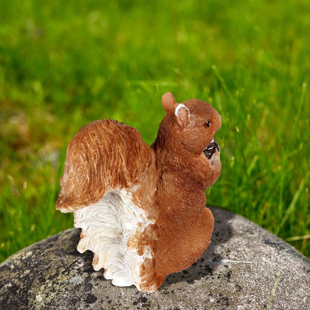 Sitting squirrel garden figure in synthetic stone