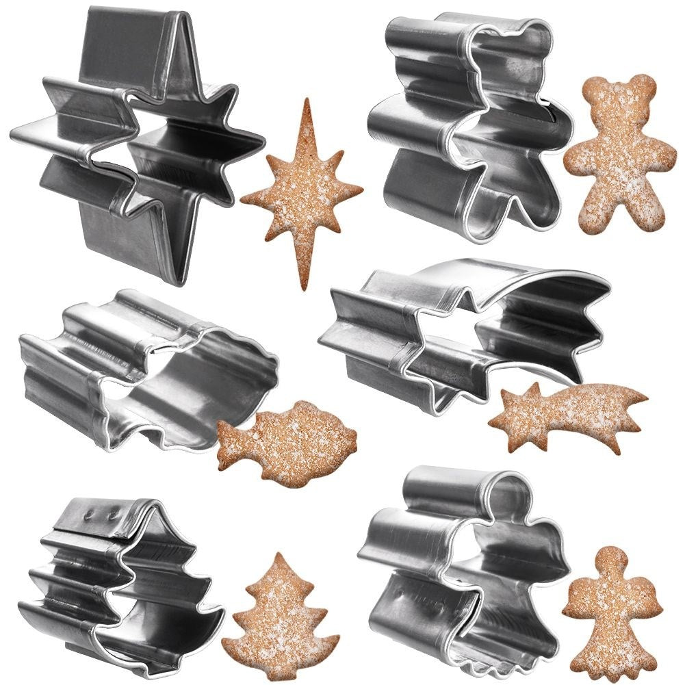 Six small cookie tins in a Christmas motif made of stainless steel