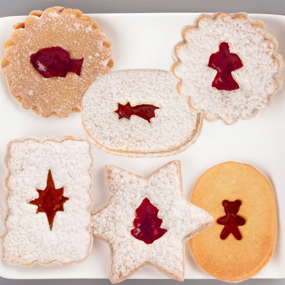 Six small cookie tins in a Christmas motif made of stainless steel