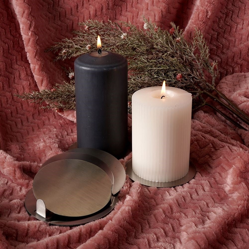 Six stainless steel coasters with protective foam