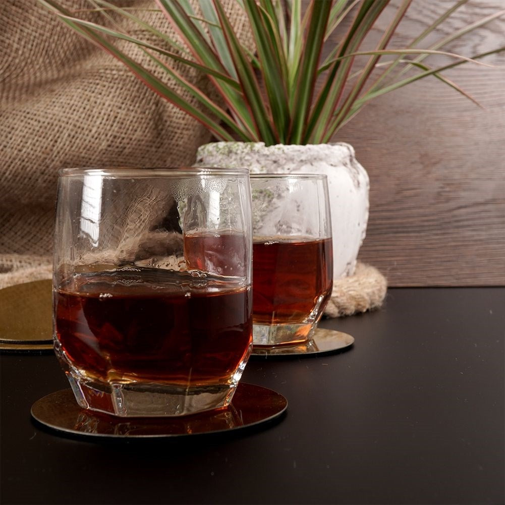 Six stainless steel coasters with protective foam