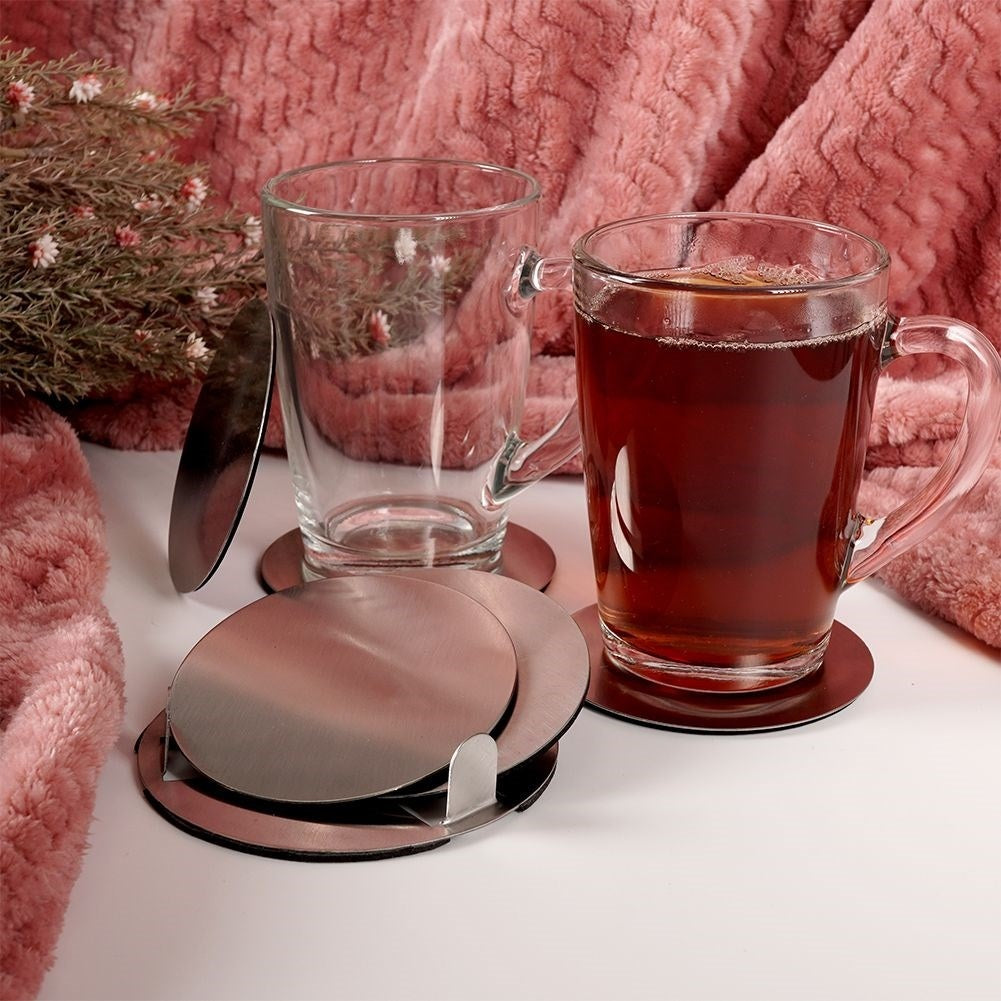 Six stainless steel coasters with protective foam